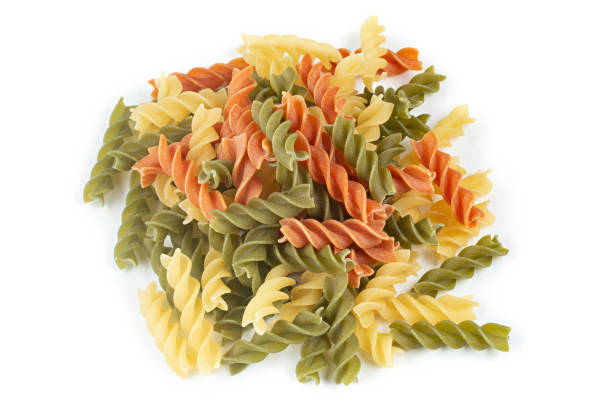 istock Raw colored pasta fusilli on a white isolated background. 1467580169