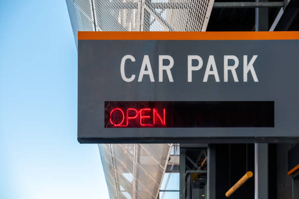 istock Car Park Open sign installed on building facade 1467582185