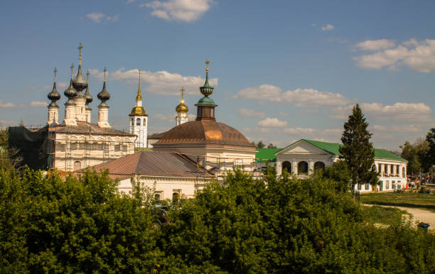 istock historical architecture with temples among green trees with lush foliage on a sunny summer day in Suzdal 1467584413