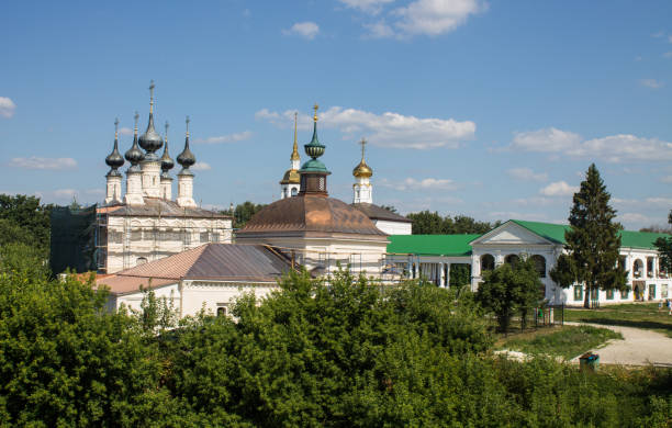 istock historical architecture with temples among green trees with lush foliage on a sunny summer day in Suzdal 1467584416