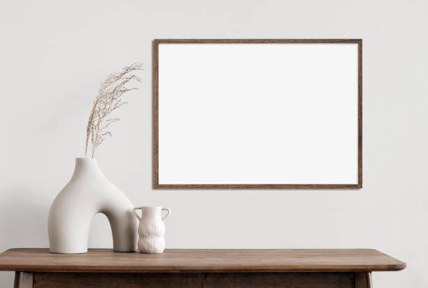 istock Artwork mockup in interior design. Blank picture frame on a wall, horizontal landscape orientation 1467584505