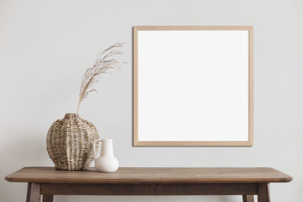 istock Artwork mockup in interior design. Blank picture frame on a wall. Square orientation 1467584600