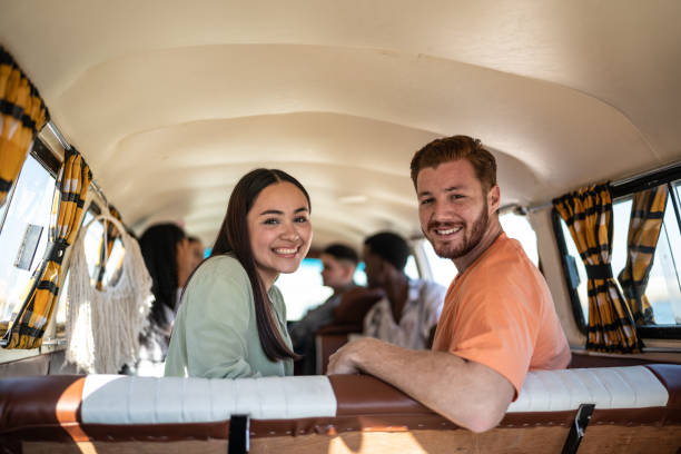 istock Portrait of young friends inside a mini van 1467584620