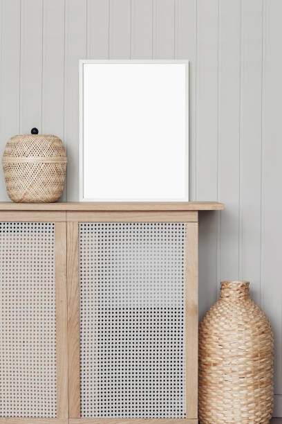istock Artwork mockup in interior design. Blank white picture frame on a wall. Vertical orientation 1467584685