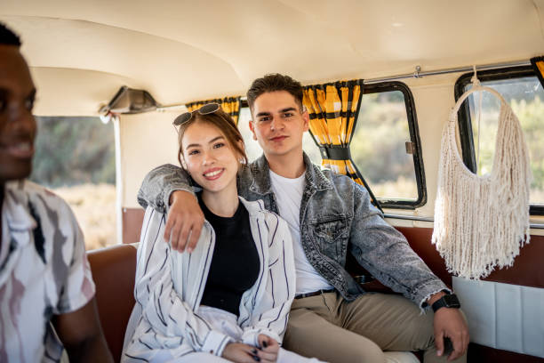 istock Portrait of young couple inside a mini van 1467584973