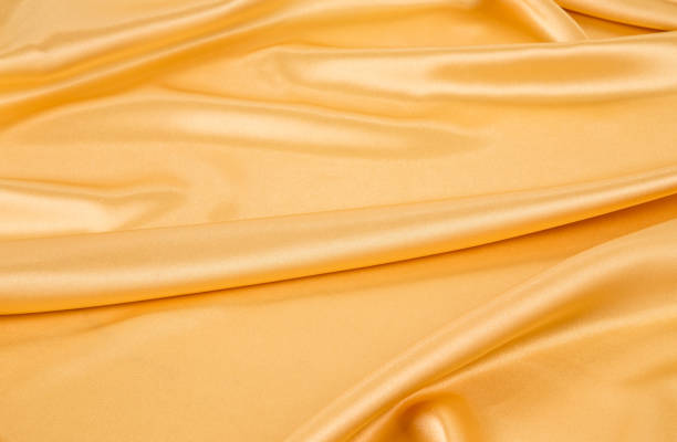 istock Close-up of golden silk cloth texture. 1467585221