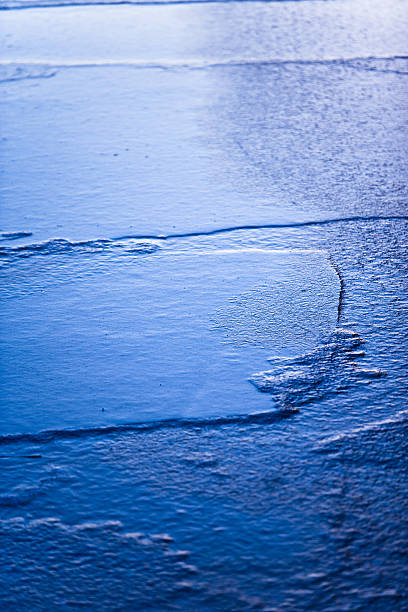 Frozen ice floes on lake stock photo