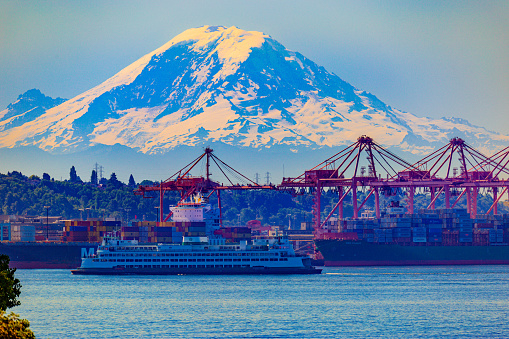 View on the Mt Rainier and Seattle port. Washington State Ferry with Port of Seattle and Mount Rainier