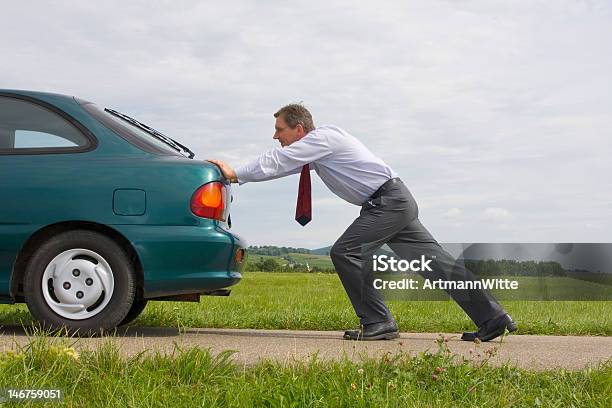 Businessman Pushing A Car Stock Photo - Download Image Now - Car, Pushing, Vehicle Breakdown