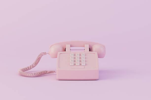 istock an old vintage pink phone on a pastel background. 3D render 1467591996