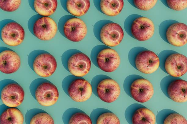 istock an abstract background consisting of patterns of red apples on a turquoise background. 3D render 1467593764