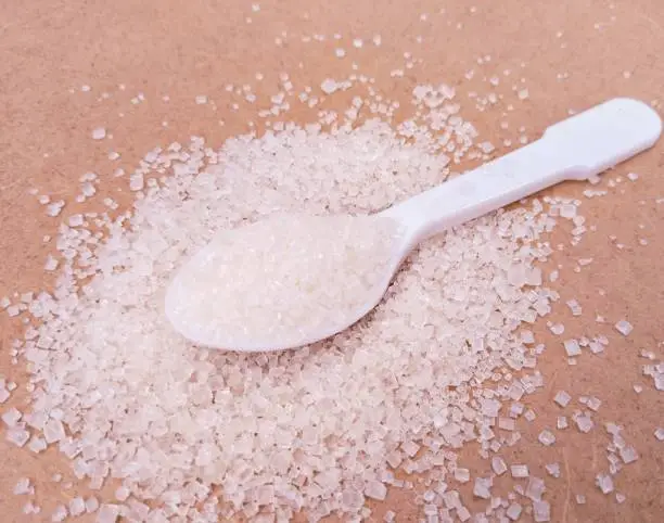 White sugar canesugar crystals granulated made from sucrose of sugarcane sweet product azucar blanca artificial sweeteners sucre blanc shakar cheeni acucar branco food ingredient zucchero bianco closeup view image stock photo