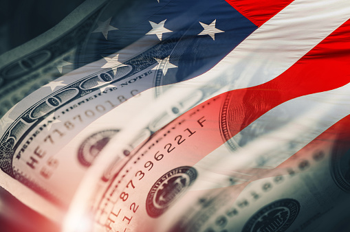 Dollar INdex Closeup Concept with American Flag. American Dollars Cash Money. One Hundred Dollar Banknotes.