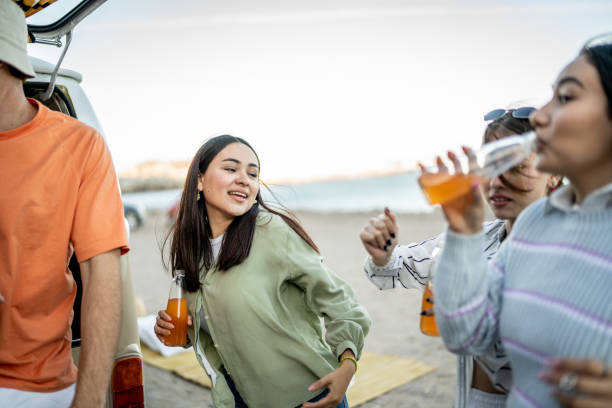 istock Young friends having a celebration outdoors 1467599749