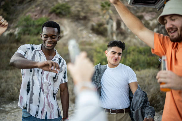 istock Young friends celebrating outdoors 1467599825