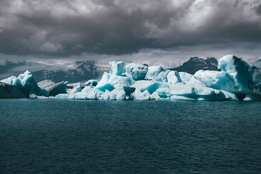 Iceberg in cloudy day