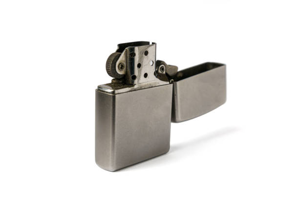 istock Metal gasoline lighter with an open lid on a white background, three quarter view 1467600643