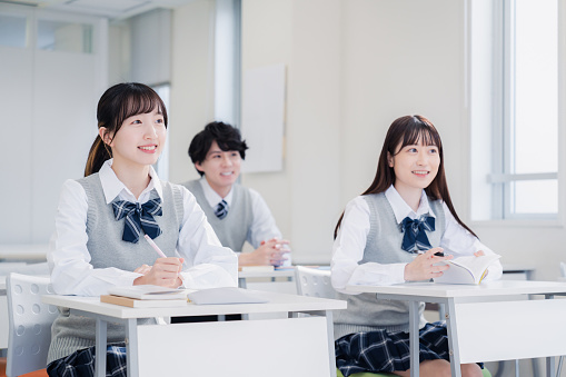 High school students enjoying class in a classroom