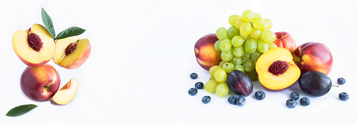Balance of nectarines, fruit and berry on the white background. Copy space. Close-up. Banner.