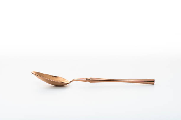 istock Golden spoon isolated on white background. 1467604722