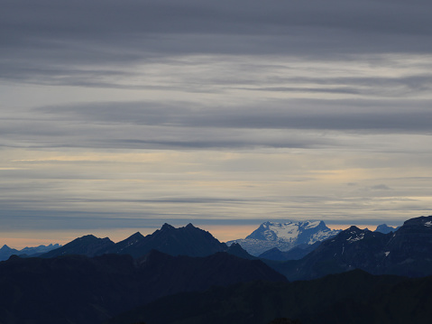 Grey clous over mountain ranges in Central Switzerland.