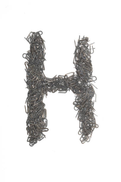 istock artistic Letter H made from steel staples isolated on a white background write, font, type style, 1467605697