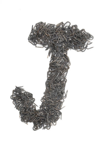 istock artistic Letter J made from steel staples isolated on a white background write, font, type style, 1467605705