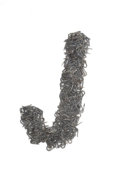 istock artistic Letter J made from steel staples isolated on a white background write, font, type style, 1467605721