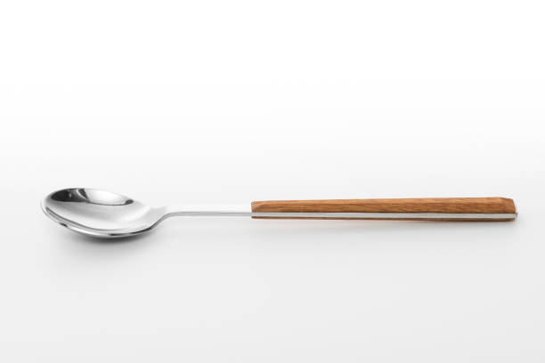 Wooden silver spoon isolated on white background.