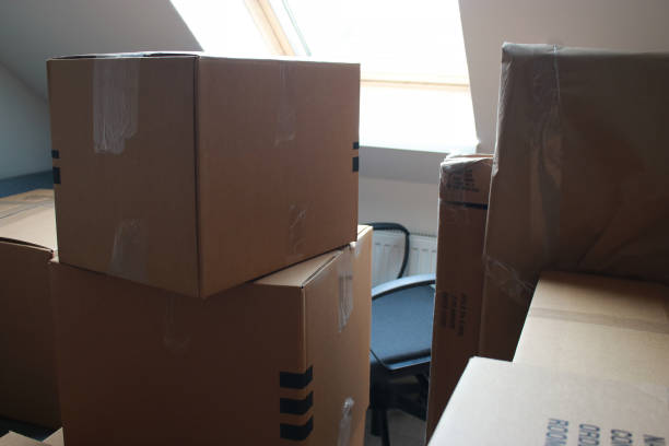 istock close up of moving cardboard boxes in a room 1467605911