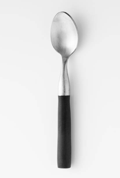 Wooden silver spoon isolated on white background.