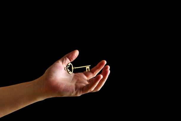 istock Vintage key levitates over the wizard's hand on a dark background 1467606825