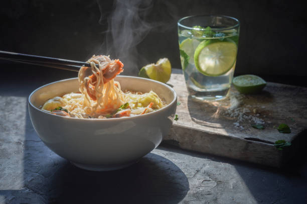 istock Delectable Roasted Pork Wonton and Egg Noodle Soup with Vegetables 1467608009