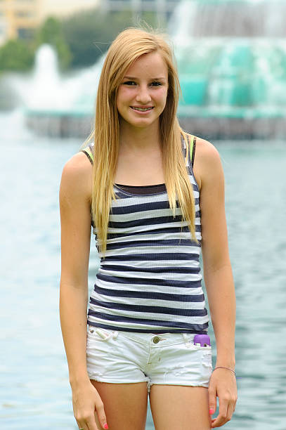 istock Young girl and fountain. 146761128
