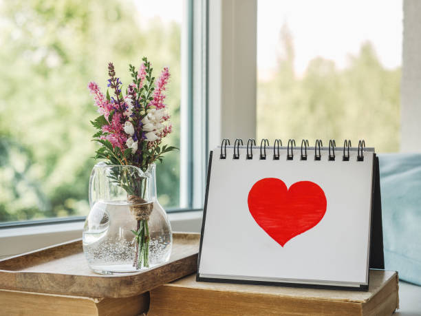istock Notepad and painted heart. Daylight. Close-up, indoors 1467612261
