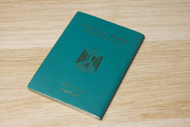 istock Egypt passport on wooden textured background 1467615203