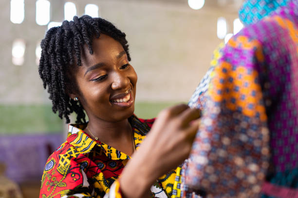 istock Smiling West African woman dressmaker in her studio 1467615879