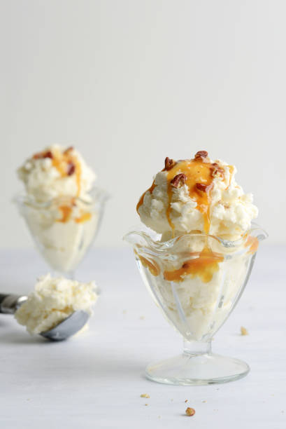 istock vanilla ice cream with pecans and caramel sauce 1467616934