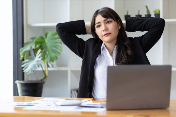 istock Business woman working in an office stretches to relax from work during breaks. 1467617266