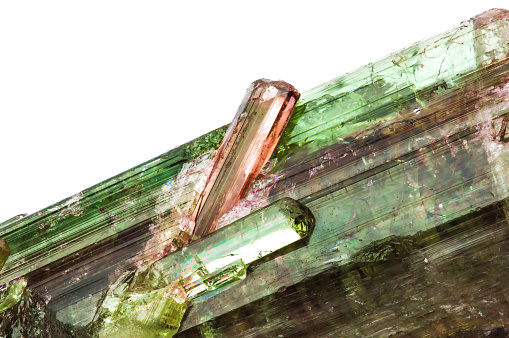 Watermelon (bicolored of pink and green) tourmaline crystal. macro detail texture background. close-up raw rough unpolished semi-precious gemstone