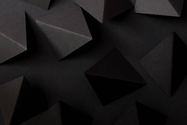 istock Black paper folded in geometric shapes 1467620251
