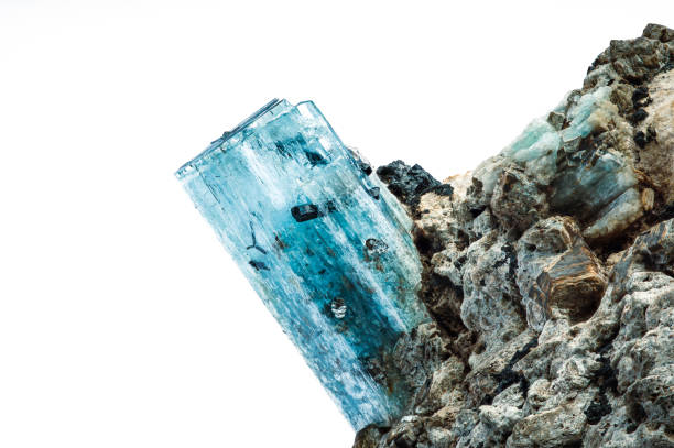 Aquamarine crystal with schorl (black tourmaline) inclusion. macro detail texture background. close-up raw rough unpolished semi-precious gemstone