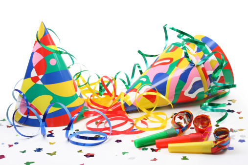 Party hats, paper streamer and  whistles isolated on white background