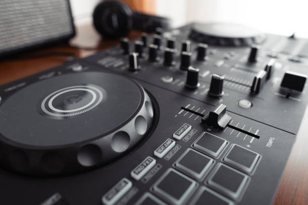 istock dj controller,DJ Spinning, Mixing, and Scratching in house 1467622882