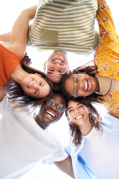 istock Vertical multiracial group young people standing in circle smiling at camera. Concept youth culture. 1467623963