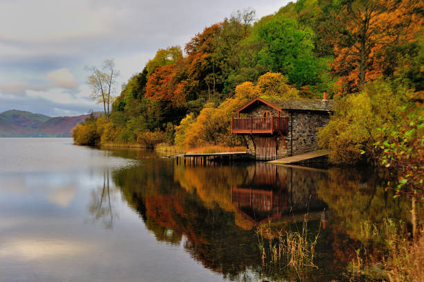 The Duke of Portland boathouse just outside Pooley Bridge on Ullswater in the English Lake District in spectacular autumn colour