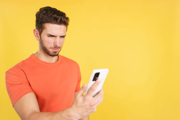 istock Worried caucasian man using a mobile phone 1467624608