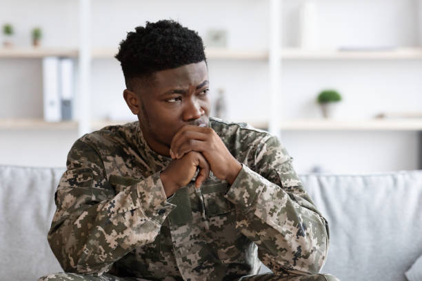 istock Depressed military black man staring at copy space 1467628395