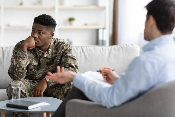 istock Depressed black guy combat having therapy session with psychologist 1467628446