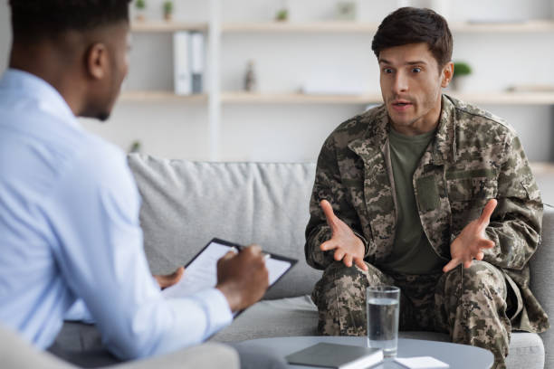 istock Emotional military man gesturing while talking to psychotherapist 1467632155